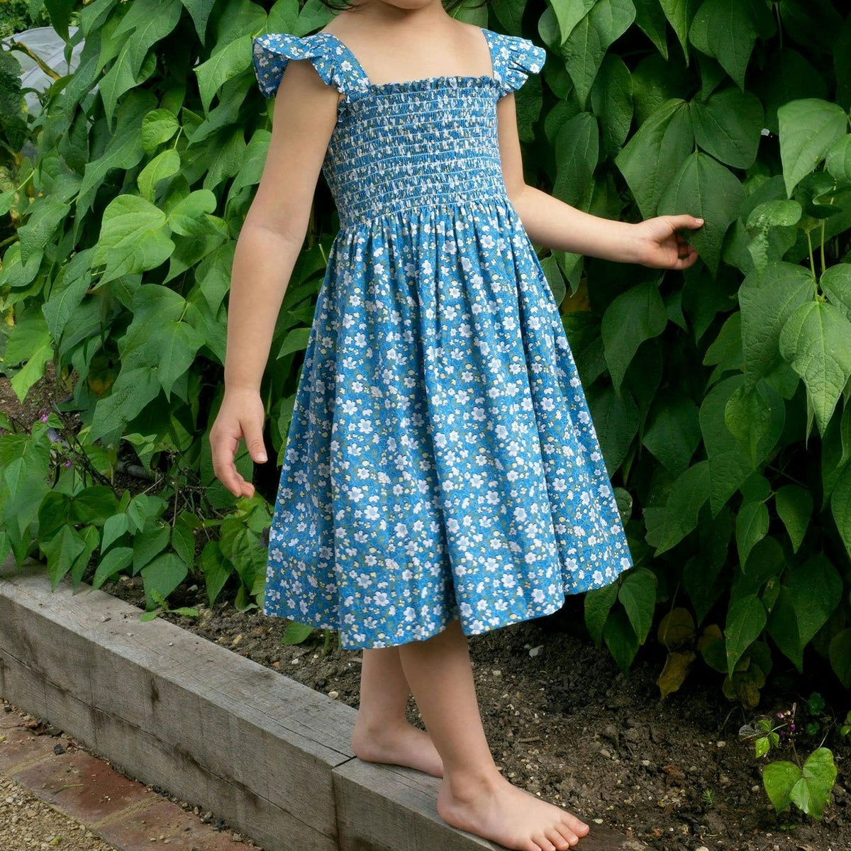 Girls' blue floral ruffle strap smocked dress