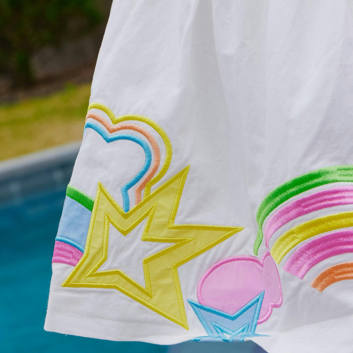 Girls' white dress with rainbow straps and star embroidery